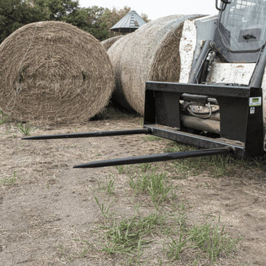 2-Prong Bale Spear for Skid Steer front view, black with extended prongs for hay bales.