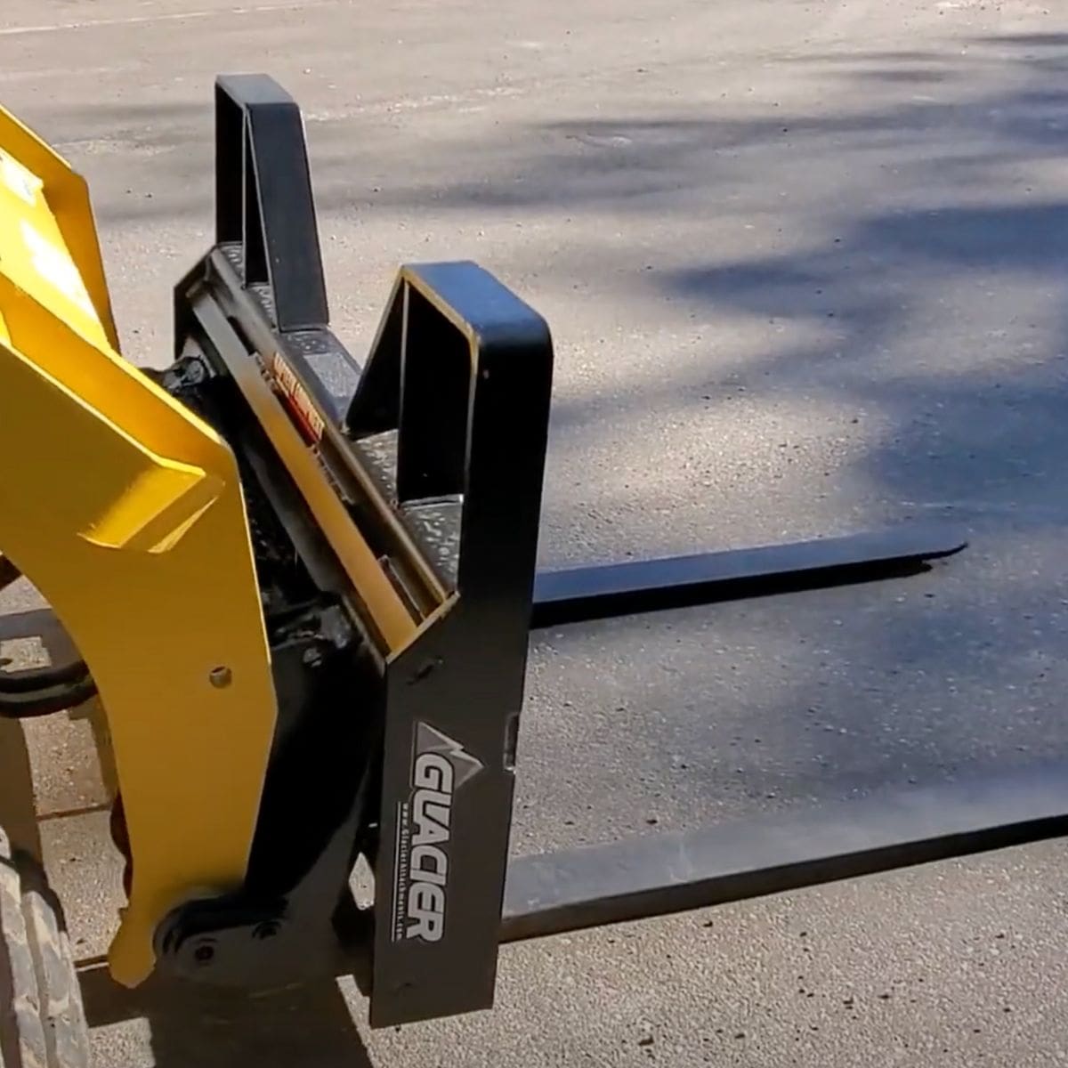 7000 Lb heavy duty pallet forks for skid steer — Glacier Attachments - Attached side view
