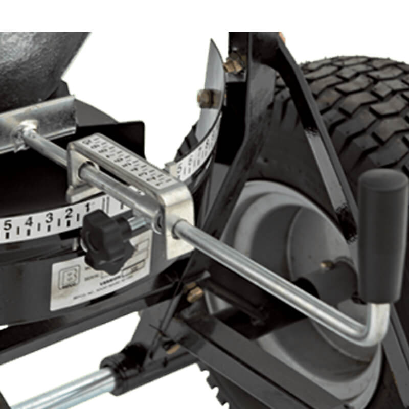 BEFCO Baby Hop Spreader close-up, black with metal handle, adjustable settings, and large wheels.