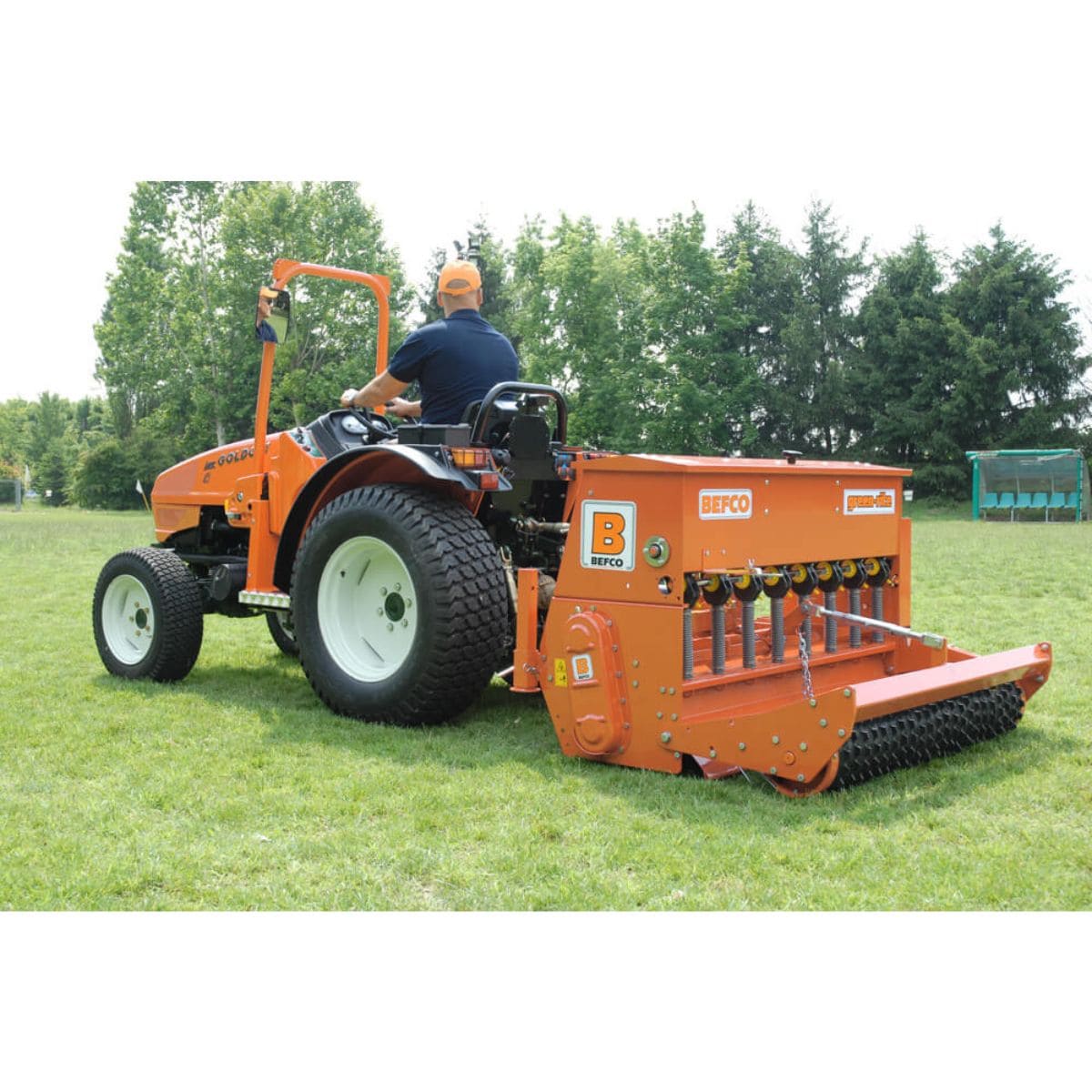 BEFCO Green-Rite Seeder and Aerator, orange, angled view with handle and aeration tines.
