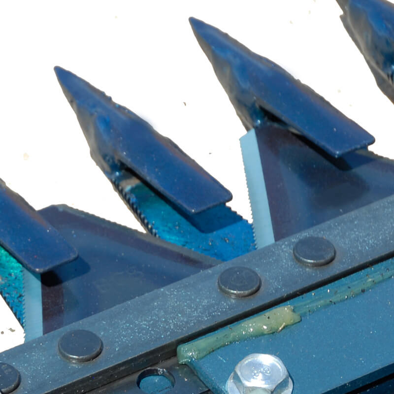 BEFCO Sickle Bar Mower blades close-up, featuring sharp metal edges and durable construction.