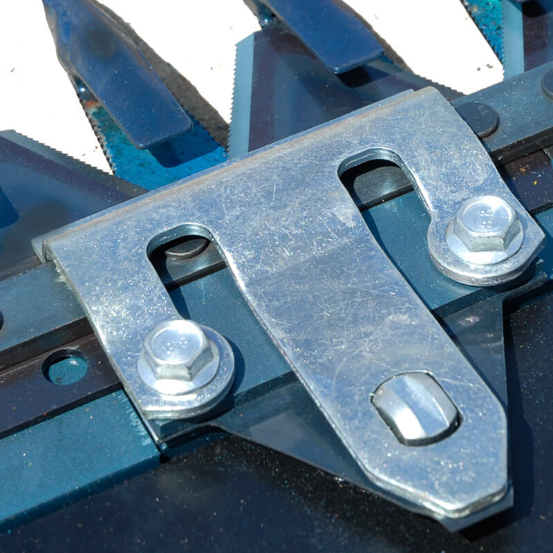 BEFCO Sickle Bar Mower metal attachment detail, featuring silver bolts and cutting blades.