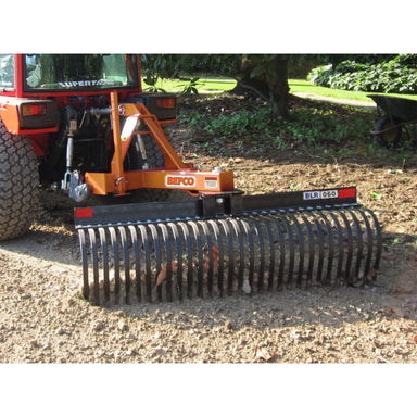 BEFCO Tractor Landscape Rake front view, orange with curved steel tines for efficient ground leveling.