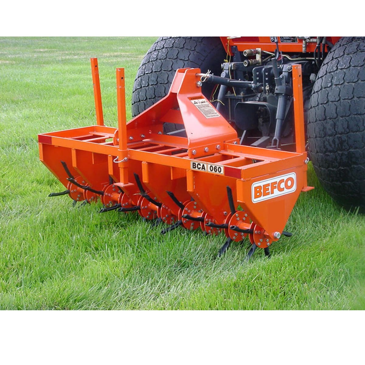 BEFCO 3 Point Core Aerator angled view, bright orange with tines and a sturdy frame.