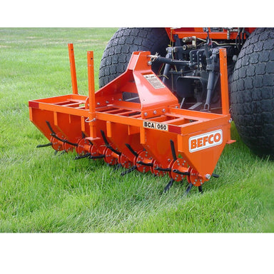 BEFCO 3 Point Core Aerator angled view, bright orange with tines and a sturdy frame.