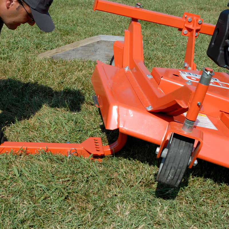 BEFCO Cyclone C30-CE5H Grooming Mower, orange, angled view with visible wheels and adjustable handle.