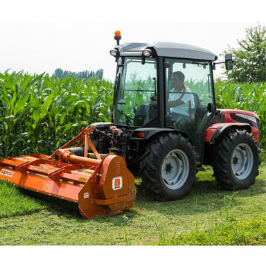 BEFCO Hurricane H70 Flail Mower, orange, angled view, mounted on tractor, cutting grass.