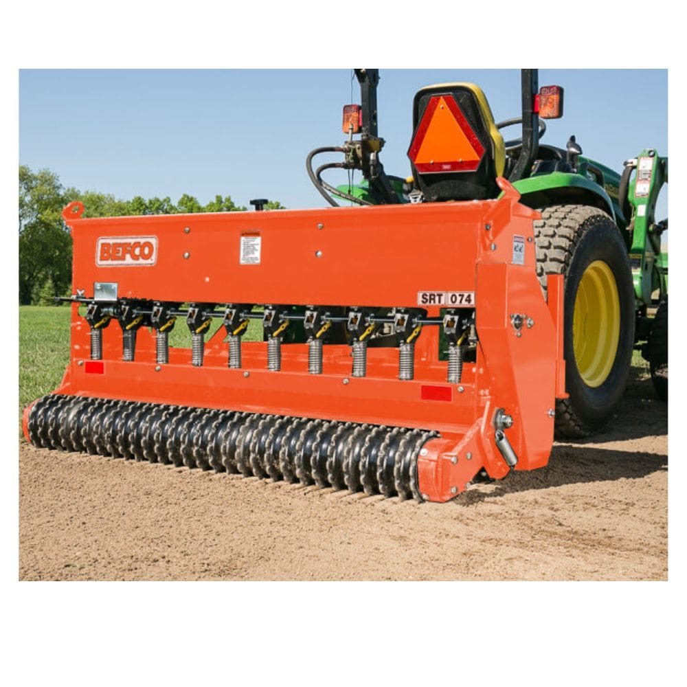 BEFCO Primary Seeder SRT, vibrant orange, front view with multiple seed hoppers and roller.