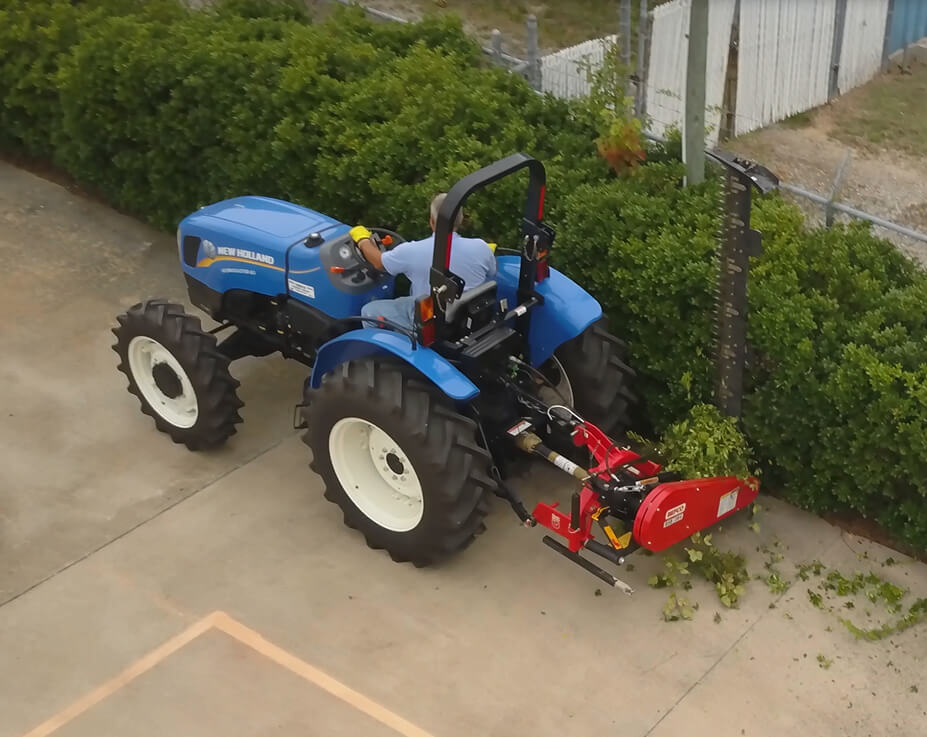 BEFCO Sickle Bar Mower angled view, red and black with sharp cutting blades attached to a tractor.