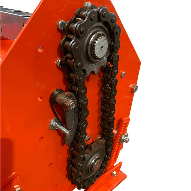 BEFCO T70 Rotary Tiller close-up view showing orange body, chain mechanism, and sprockets.