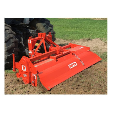 BEFCO T70 Rotary Tiller in vibrant orange, angled view with connected tractor and tilling blades.
