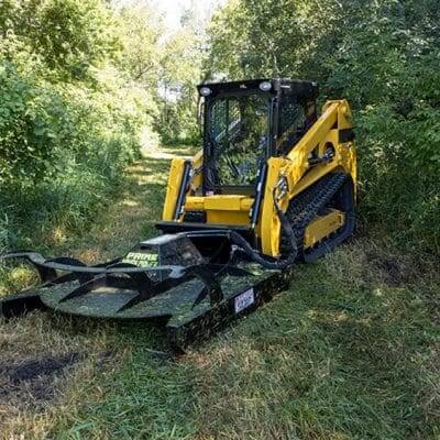 Brush Mower Attachment by Prime Attachments, featuring a yellow and black design, angled view.