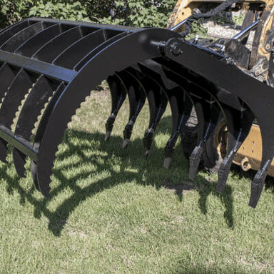Clamshell Grapple for Skid Steer by Prime Attachments, black with curved tines and robust design.