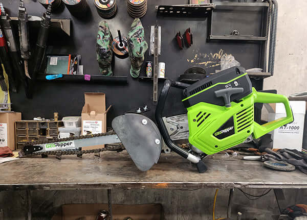 GeoRipper 20 MiniTrencher side view, vibrant green and black with a cutting chain and handle.