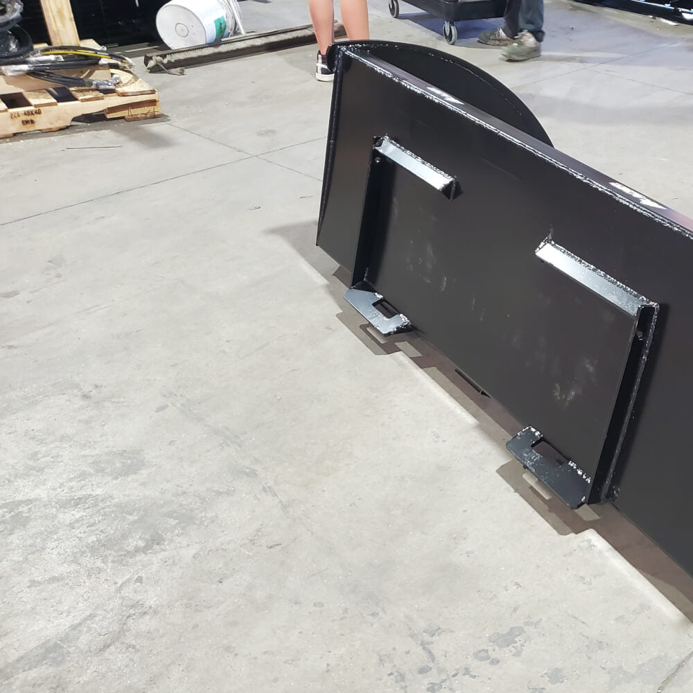 Glacier Attachments skid steer snow bucket, black, angled view with reinforced edges.