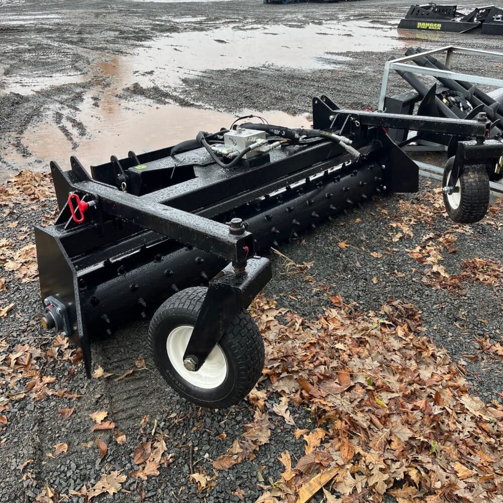 HD Soil Conditioner — Prime Attachments angled view, black with wheels and textured surface.