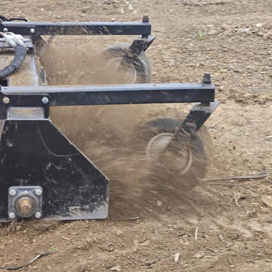 HD Soil Conditioner by Prime Attachments, front view with spinning wheels and dust dispersal.
