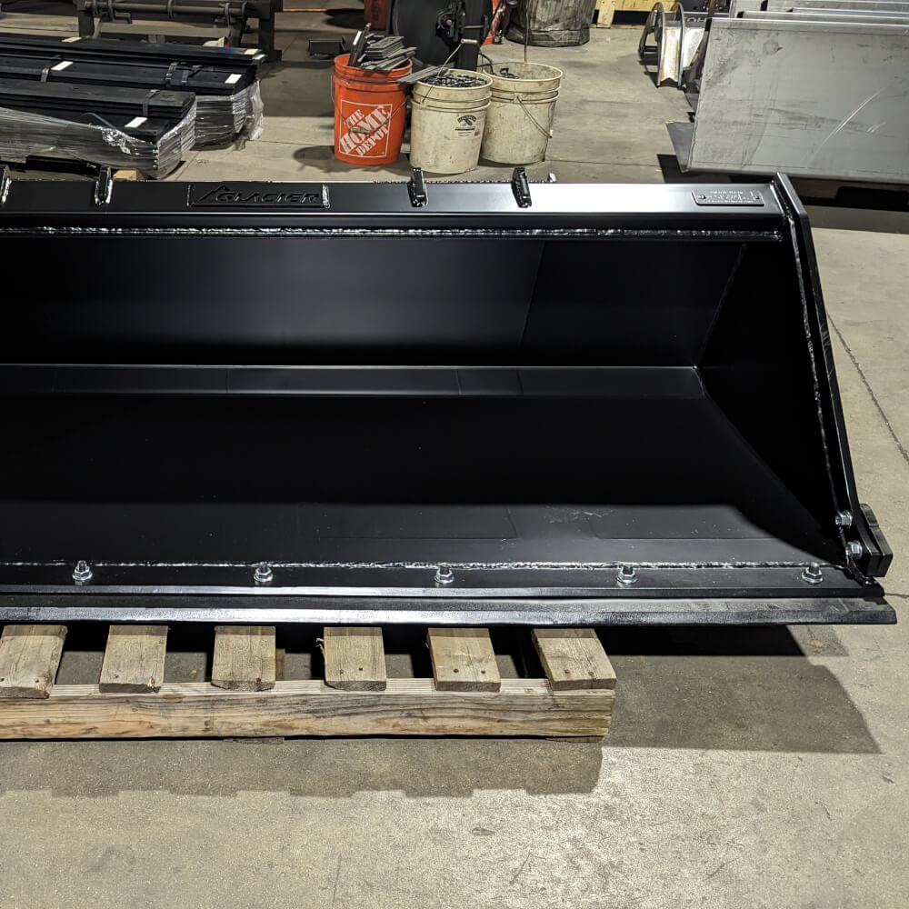 Heavy Duty Bucket for Skid Steer by Glacier Attachments, angled view, robust black design.