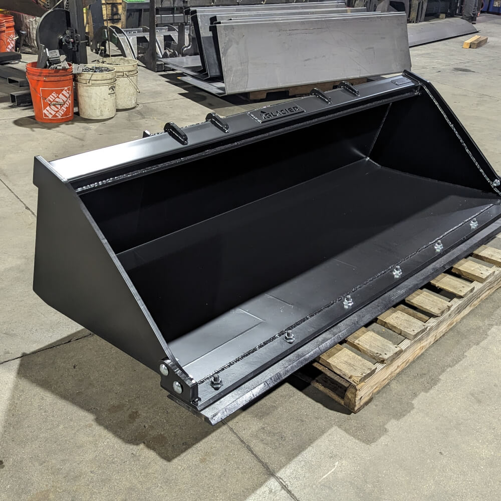 Glacier Attachments Heavy Duty Bucket for Skid Steer, black, angled view with secure mounting points.