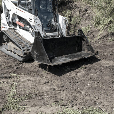 Skid Steer 4-in-1 Bucket by Prime Attachments, black, angled view with durable steel construction.