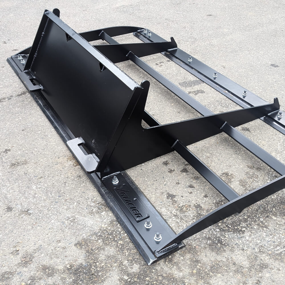 Skid Steer Land Plane Attachment by Glacier Attachments, black, angled view with robust steel frame.