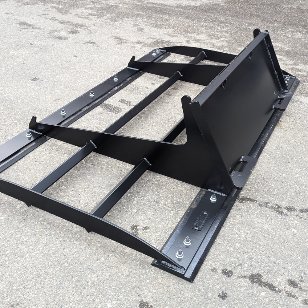 Skid Steer Land Plane Attachment by Glacier Attachments, black, angled view, featuring sturdy metal frame.