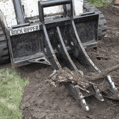 Skid Steer Rock & Root Ripper by Prime Attachments, angled view, black with three sturdy tines.
