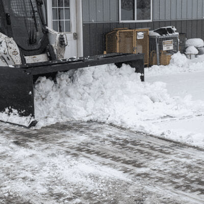 Skid Steer Snow Box by Prime Attachments, front view, black, clearing snow efficiently.