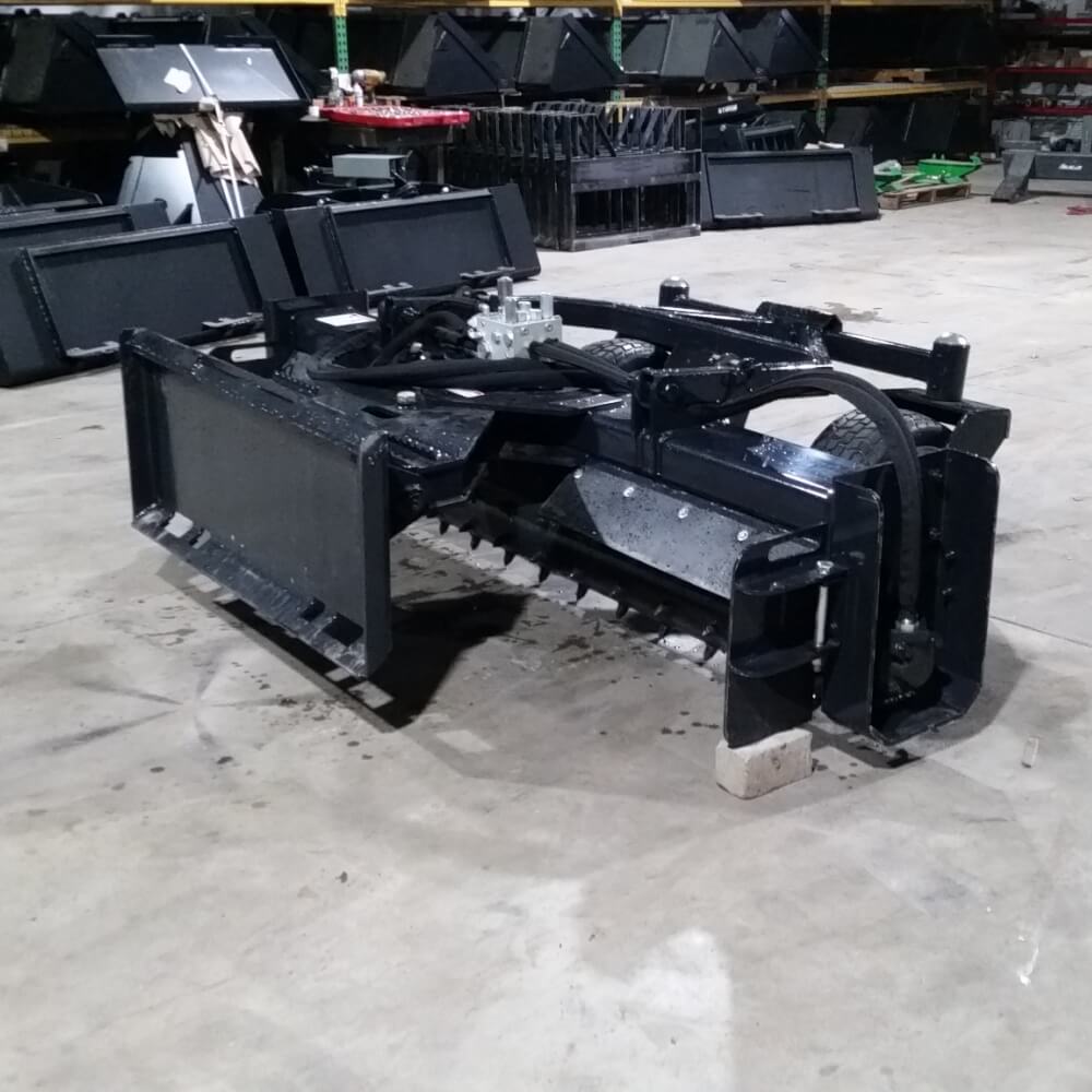 Skid Steer Soil Conditioner by Glacier Attachments, black, angled view with cutting blades.