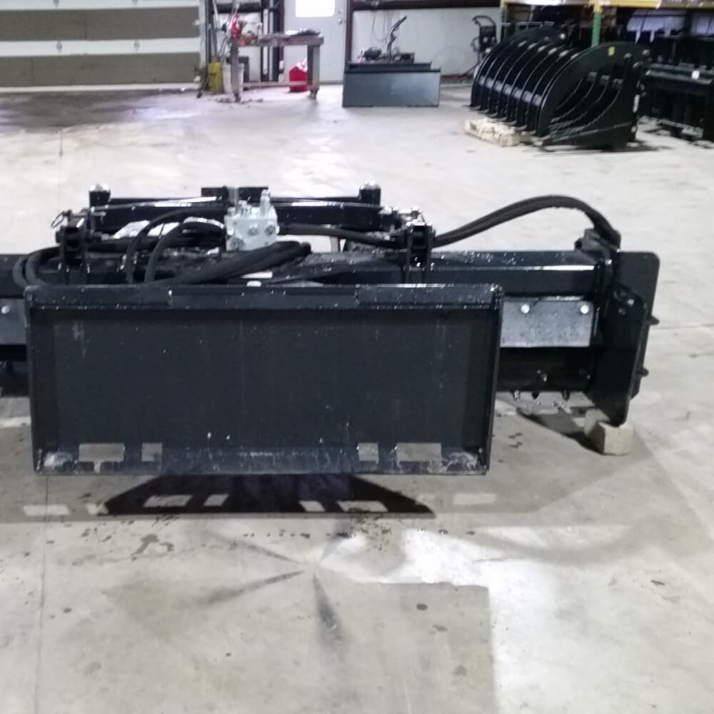 Skid Steer Soil Conditioner by Glacier Attachments, black front view with hydraulic hoses.