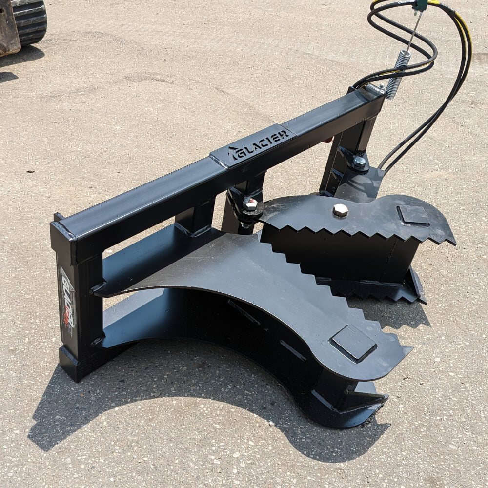 Glacier Attachments Skid Steer Tree Puller, black, angled view with serrated gripping claws.