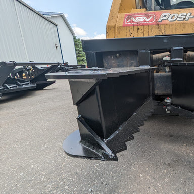 Glacier Attachments Skid Steer Tree Puller, black, front view with serrated edges and robust design.