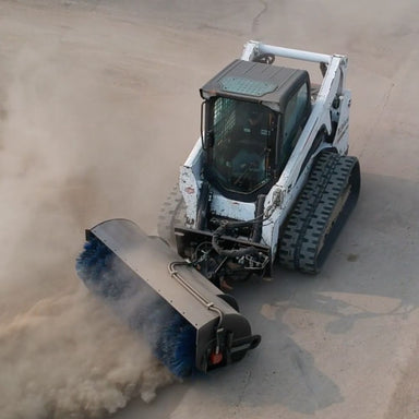 Top view of a Bobcat using a Power Sweeper