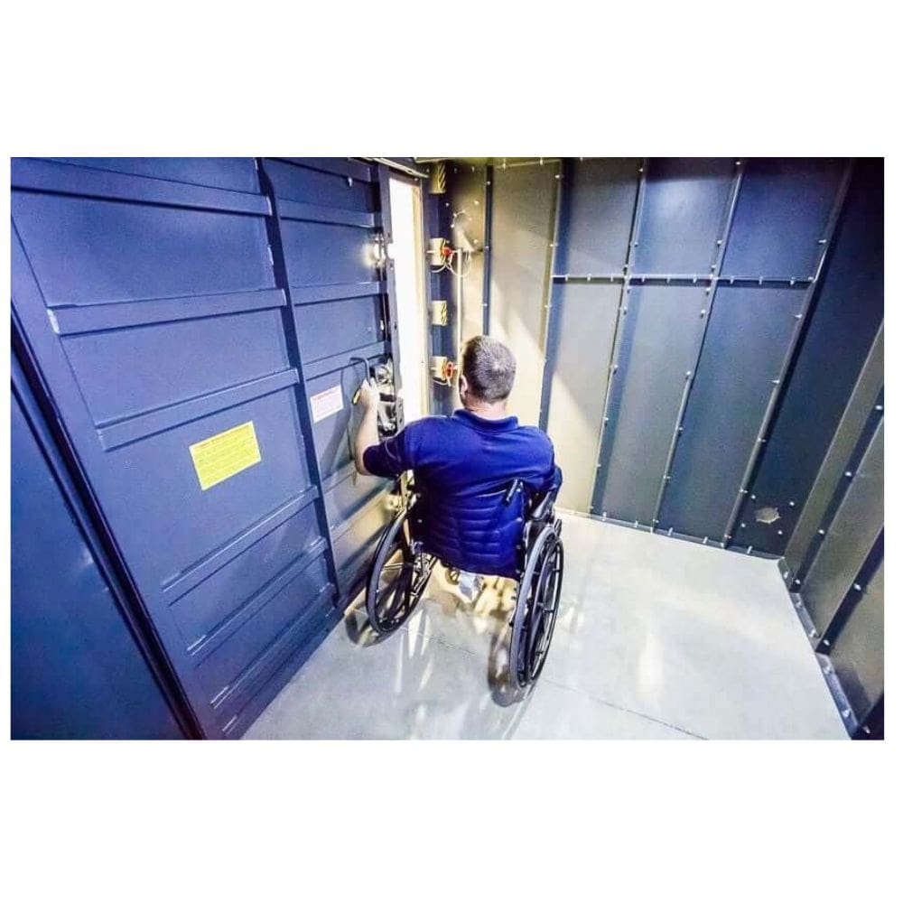 Swisher 20 Person ESP Wheelchair Accessible Storm Shelter, front view, sturdy metal design with wheelchair access.