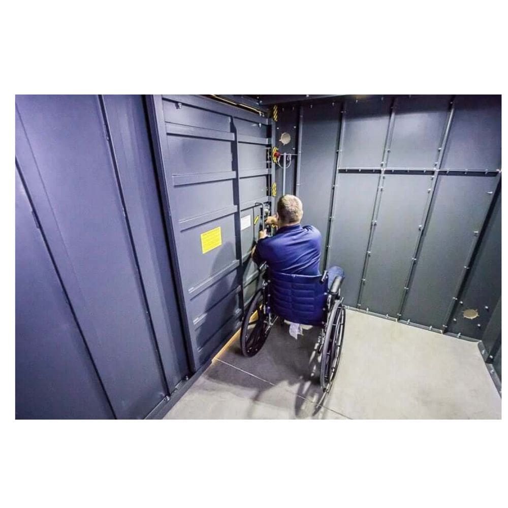 Swisher 20 Person ESP Wheelchair Accessible Storm Shelter interior view, featuring a door and wheelchair.