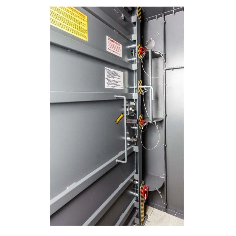 Swisher 25 Person ESP Safety Shelter interior view, featuring gray metal panels and safety mechanisms.