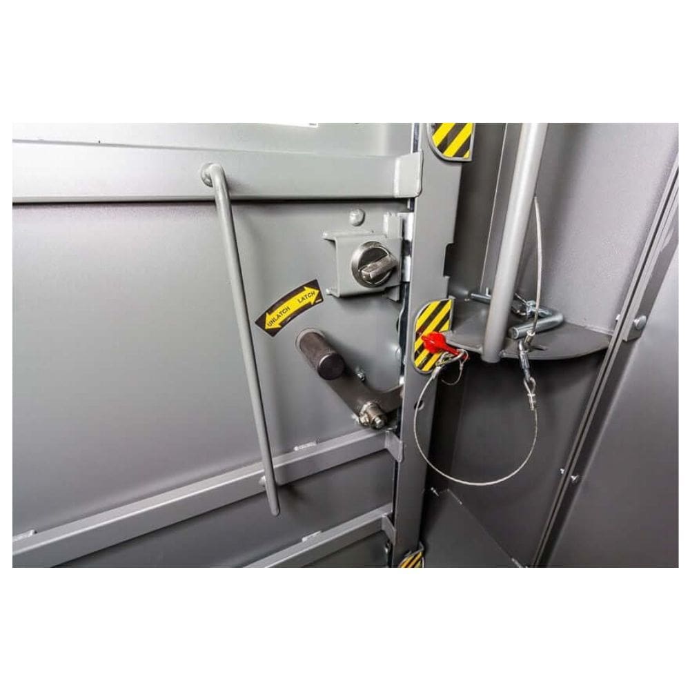 Swisher 6 Person ESP Safety Shelter interior door latch, grey with safety labels and locking mechanism.