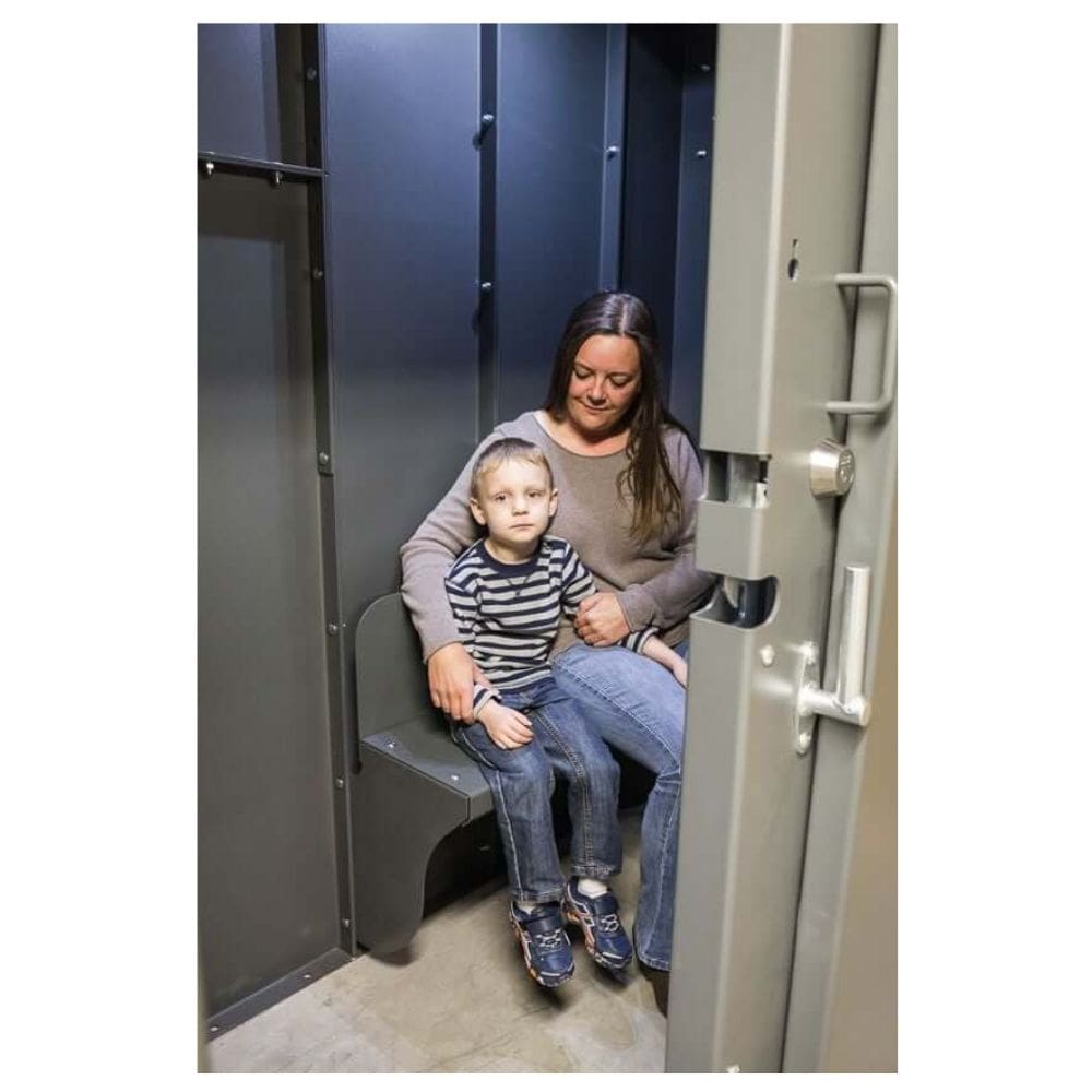 Swisher 6 Person ESP Safety Shelter interior view, featuring gray walls and seating.