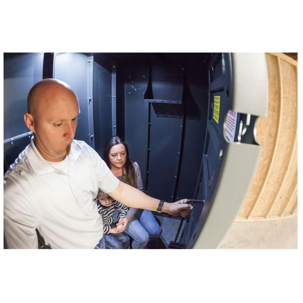 Swisher 6 Person ESP Safety Shelter, interior view with sturdy walls and secure door handle.