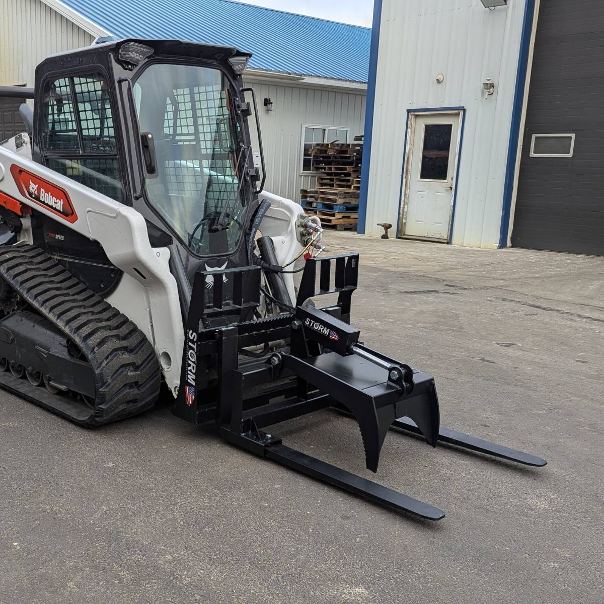 Storm Attachments Fork Grapple Attachment Front View Attached