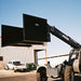 Star forklift trash hopper lifted by telehandler