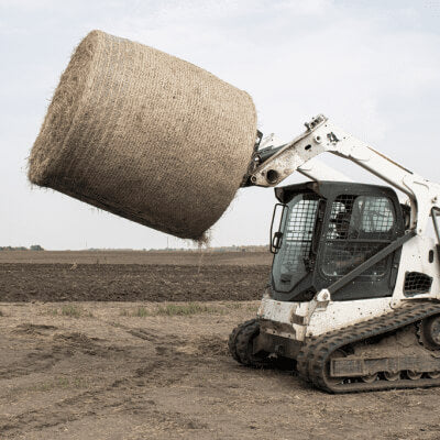 2-Prong Bale Spear for Skid Steer, angled view, designed for lifting hay bales efficiently.