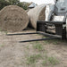 2-Prong Bale Spear for Skid Steer front view, black with extended prongs for hay bales.
