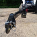 20 Ft Skid Steer Truss Boom by Glacier Attachments, black metal, front view with adjustable hitch.
