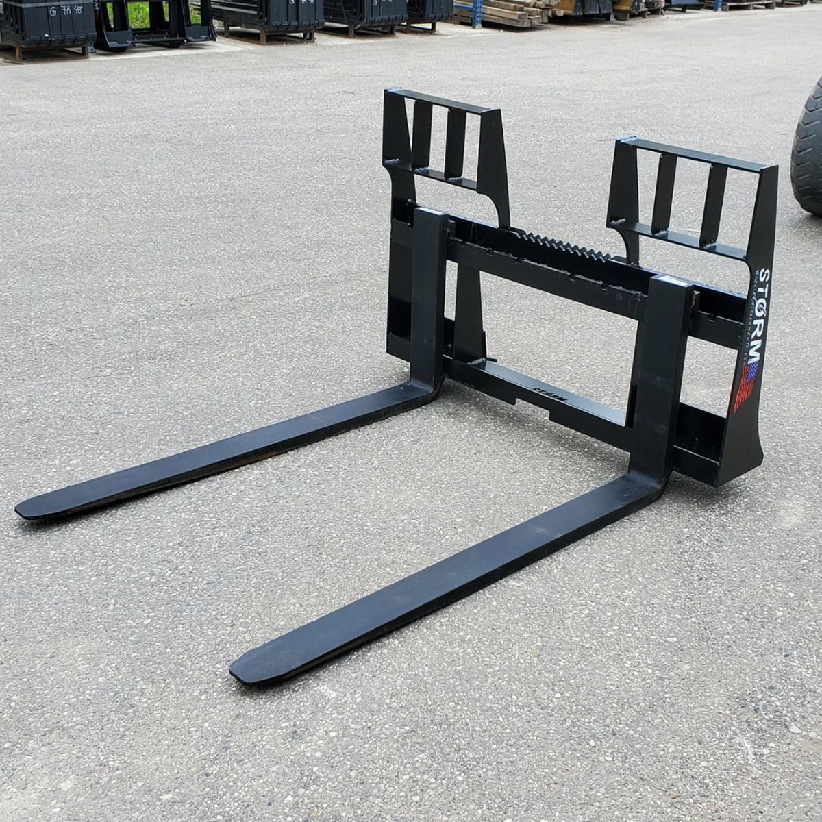 4500 lb capacity Storm Pallet Forks with durable steel construction and walk-through frame design.