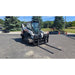 6000 Lb Skid Steer Hydraulic Pallet Forks sideview on Skid Steer