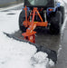 BEFCO 3 Point Rear Blade for Tractor, orange with a black blade, angled view clearing snow.