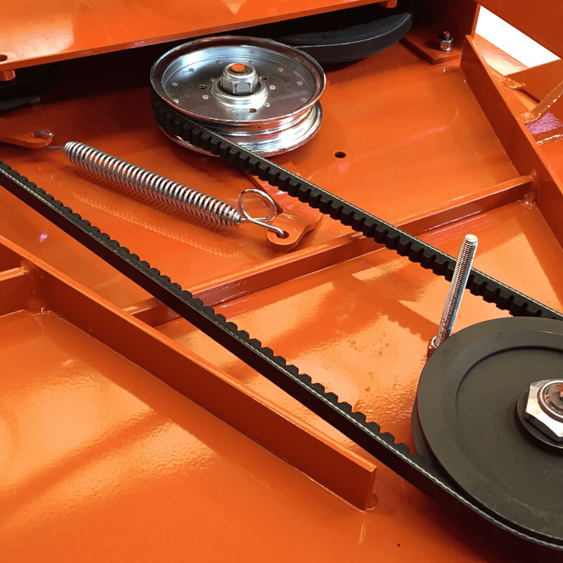 BEFCO Cyclone C30 Grooming Mower parts close-up, featuring black belts, a metal pulley, and an orange base.