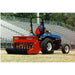 BEFCO Green-Rite Seeder and Aerator in red, side view, mounted on a blue tractor.
