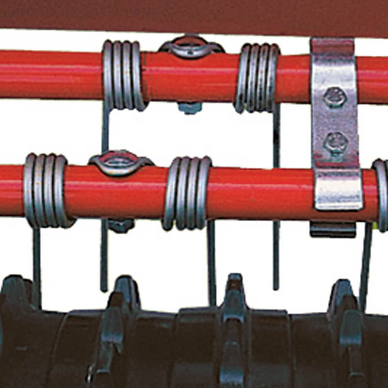 BEFCO Green-Rite Seeder and Aerator close-up view, featuring red bars and metallic fasteners.